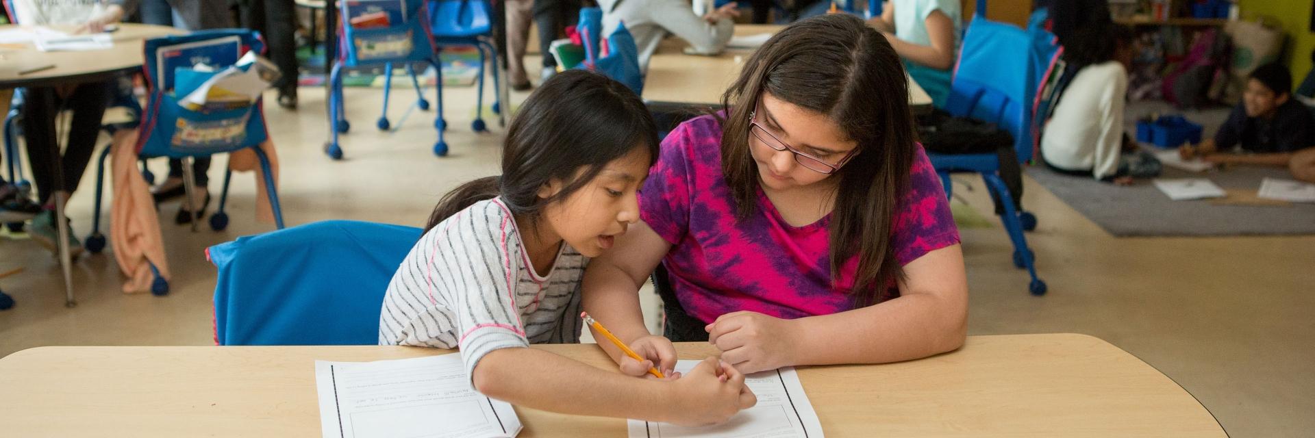 teacher teaching a girl